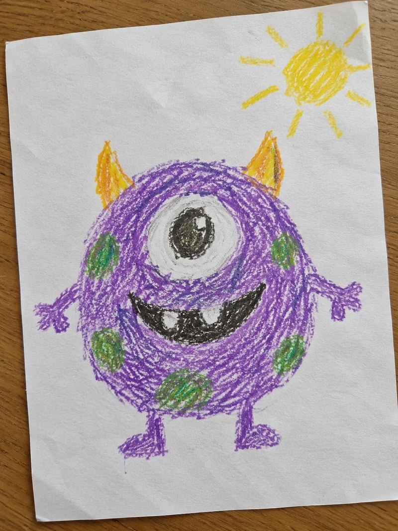 Child's crayon drawing of a purple one-eyed monster with horns and green spots under a yellow sun